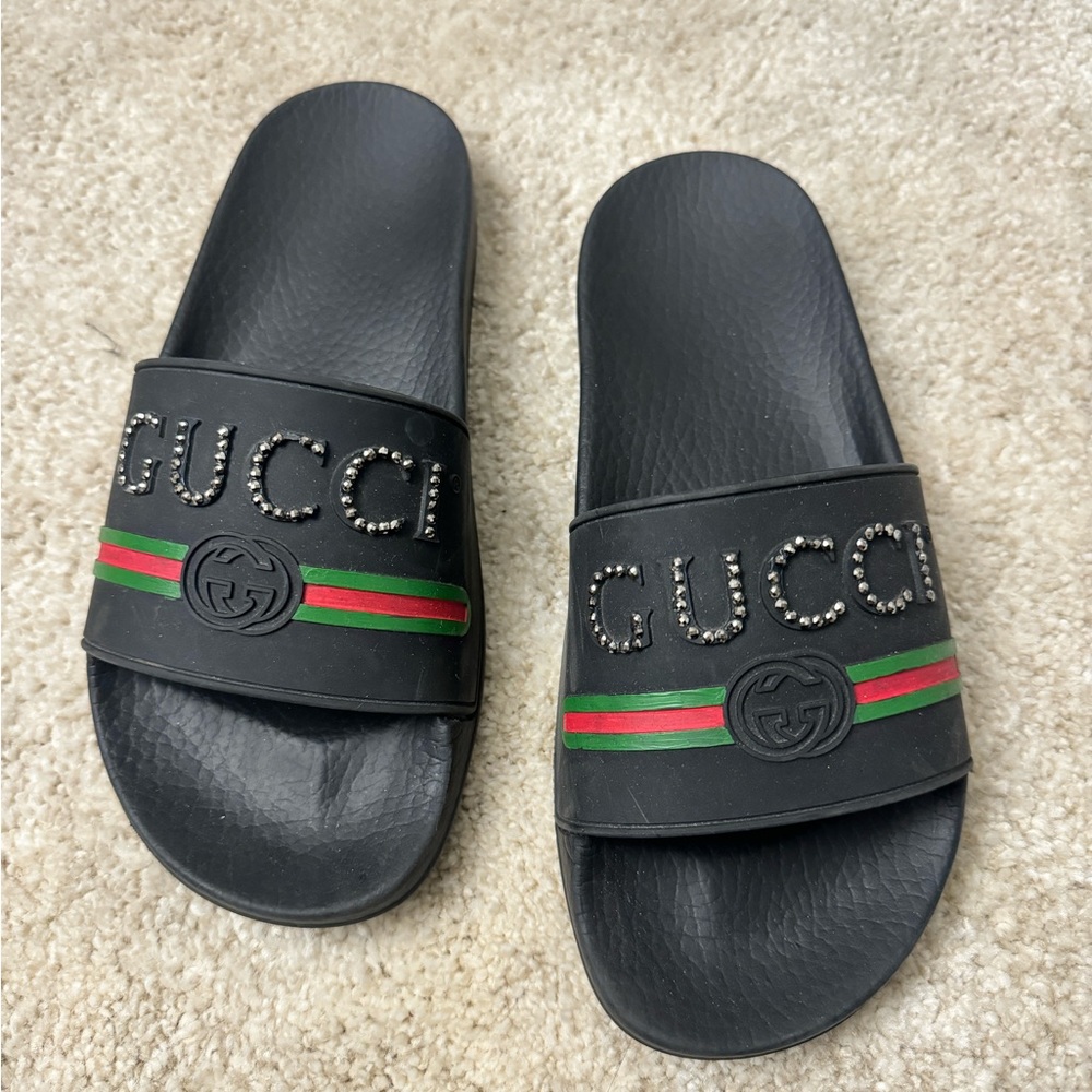 Customized Gucci slides size 37 which is equivalent to a size 6 in women’s.